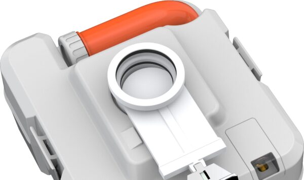 Close-up view of a grey and white device with a red switch and round opening, possibly a component of machinery or equipment.